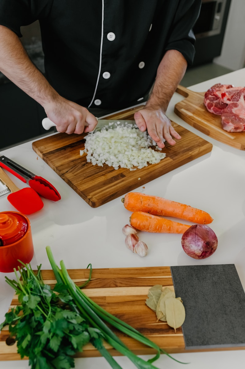 A chef preparing food on a cutting board